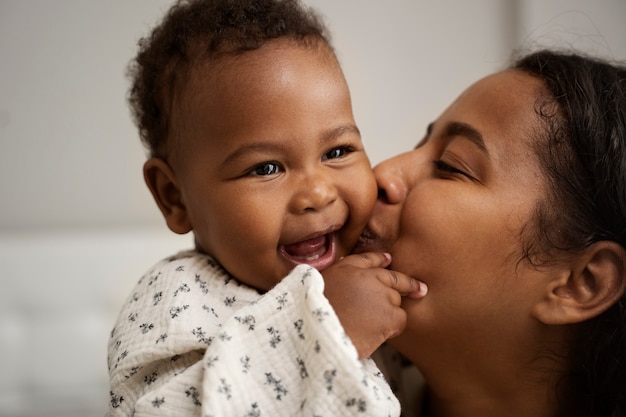 Black mother taking car of her child