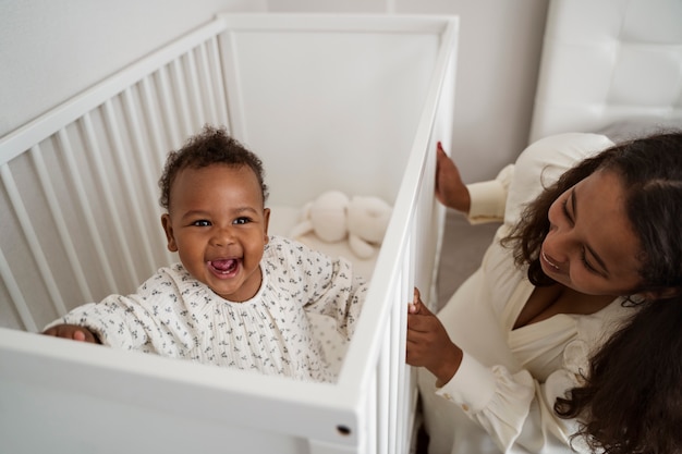 Black mother taking car of her child