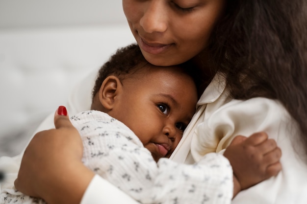 Black mother taking car of her child