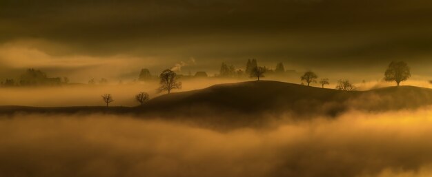 Black mountain surround in fog