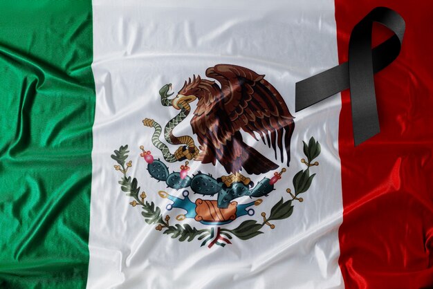 Black mourning ribbon with mexican flag