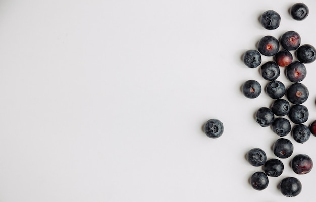 Black olives top view on a white background space for text