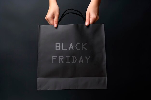 Black paper bag mockup. Female Hand Holding black Paper Bag. Black friday