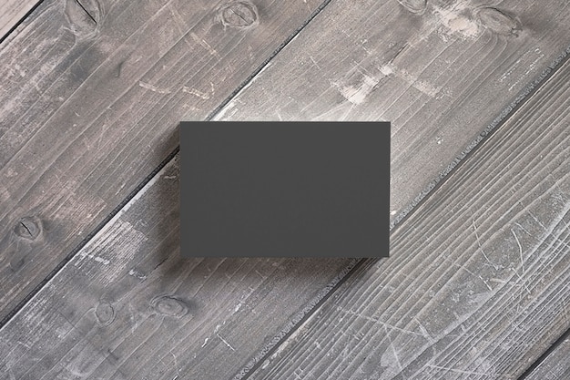 Black paper business cards stack on wooden desks. Template to showcase your presentation.