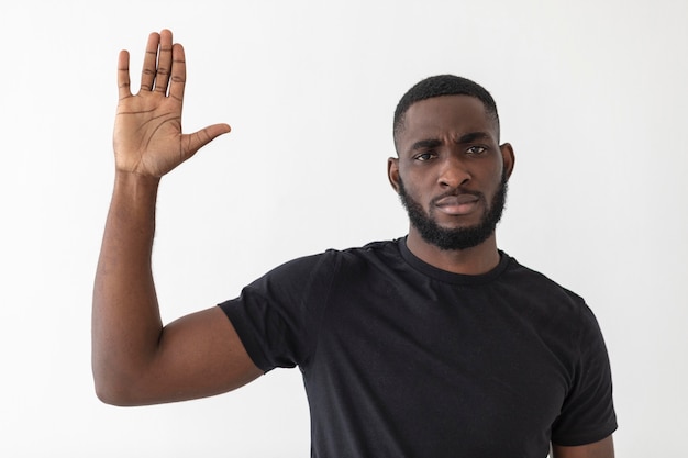 A black person waving with his hand