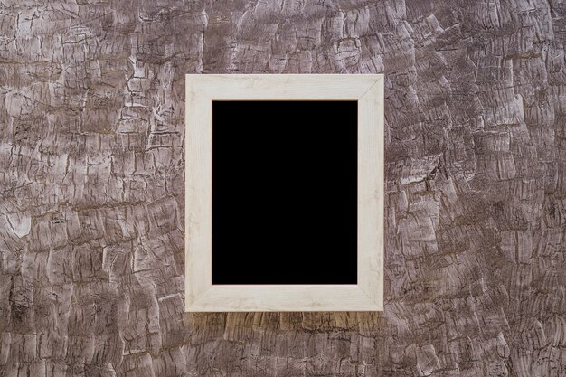 Black picture frame on painted design wall