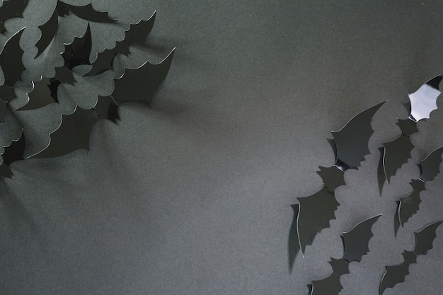 Black plastic Halloween bats in corners