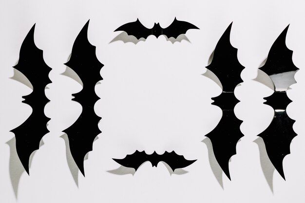 Black plastic Halloween bats laid in order