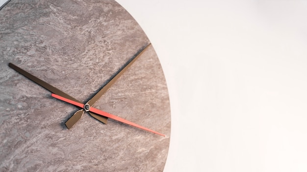 Black and red clock hands against white background