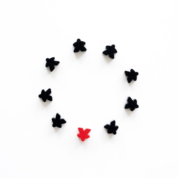 Black and red meeple board game pieces