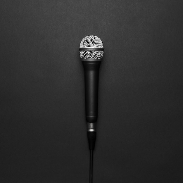 Free photo black and silver microphone on a black background