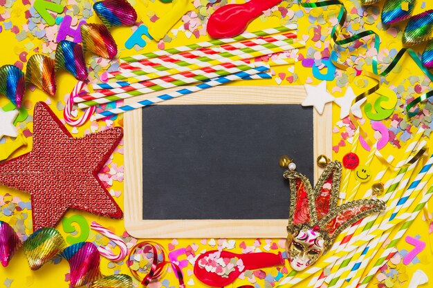 Black slate with party decoration, ringlets and a red star