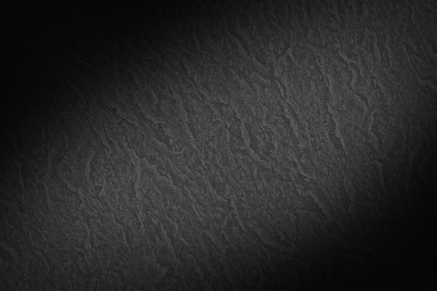 Free photo black smooth textured paper background