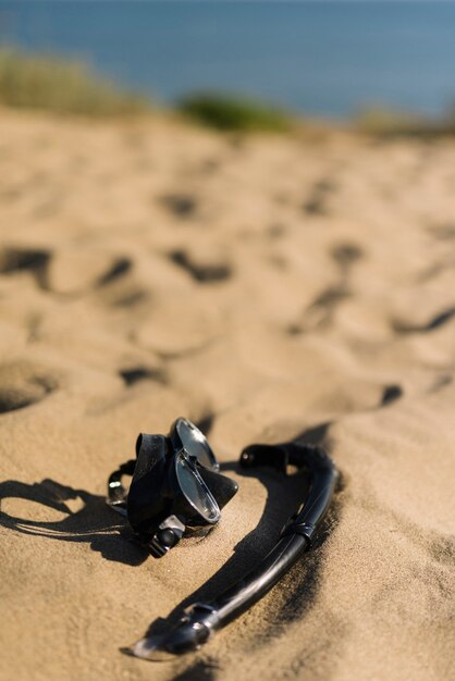 Black snorkel on the sand