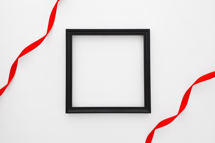 Free Photo black square frame with two red tie on white background