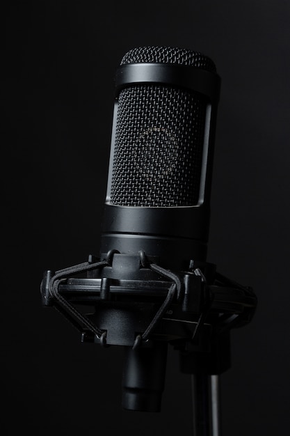 Free photo black standing microphone in studio