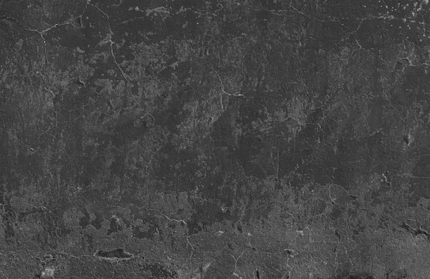 Free photo black stucco wall with slight cracks