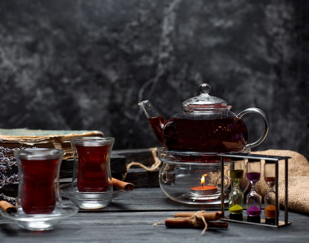 Free photo black tea with cinnamon on the table