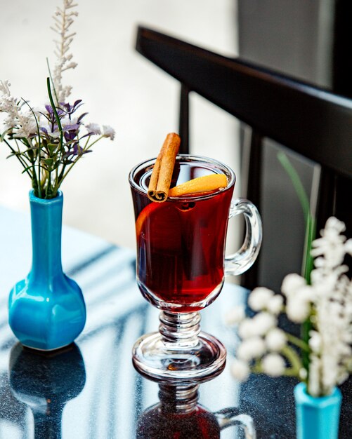 Black tea with cinnamon on the table