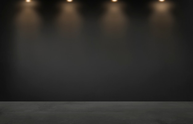 Free photo black wall with a row of spotlights in an empty room