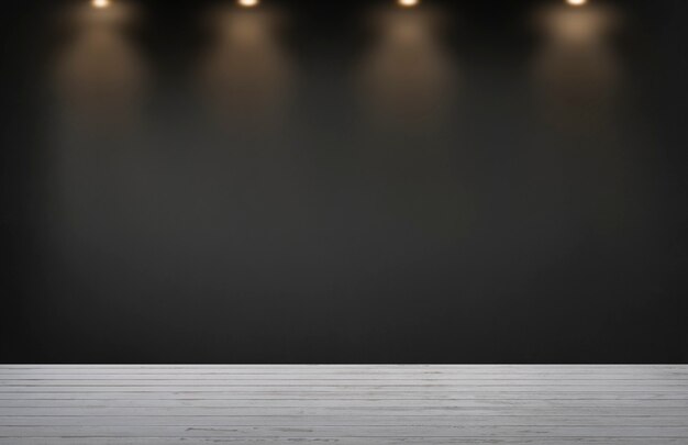 Black wall with a row of spotlights in an empty room