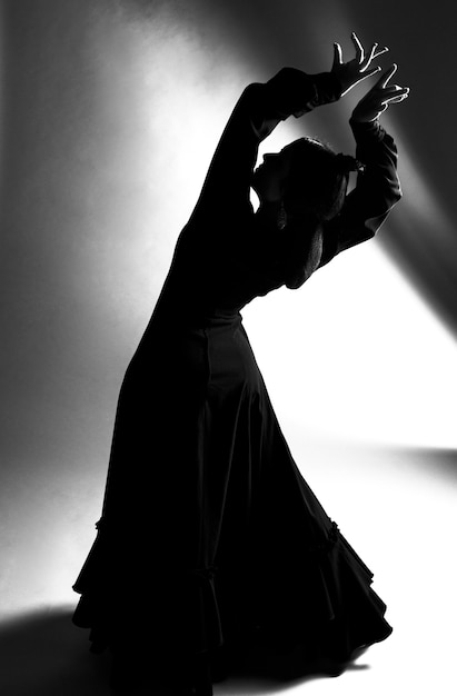 Black and white full shot dancer bending back