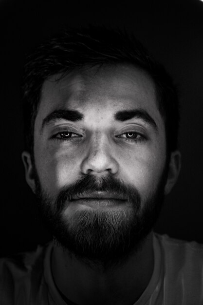 Black and white photo of bearded man