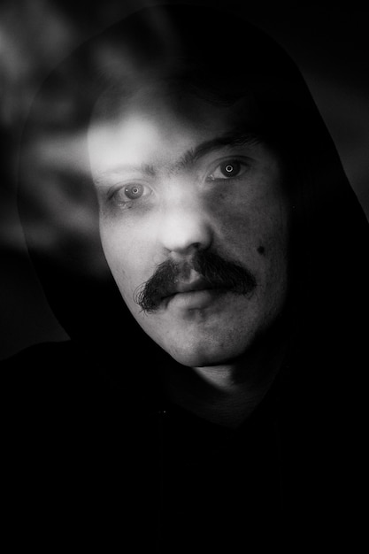 Black and white portrait of man with mustache