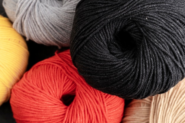 Black, white and red wool yarn