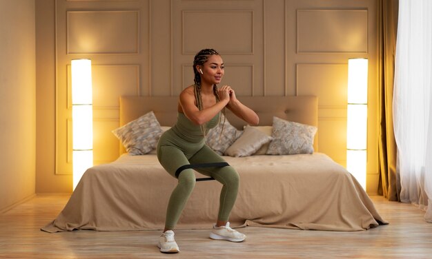 Black woman doing fitness at home