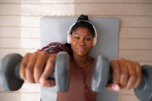 Black woman doing fitness at home