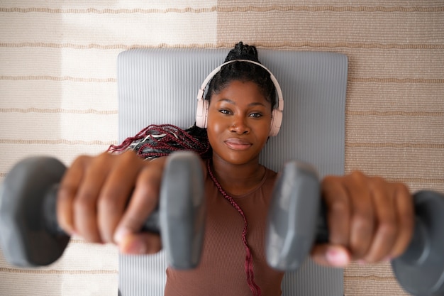 Black woman doing fitness at home