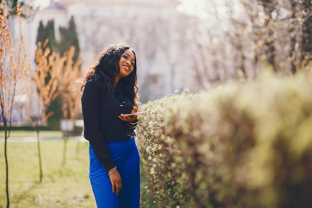 Free photo black woman in a  park