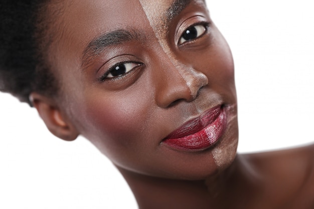 Black woman with half face on makeup, beauty concept