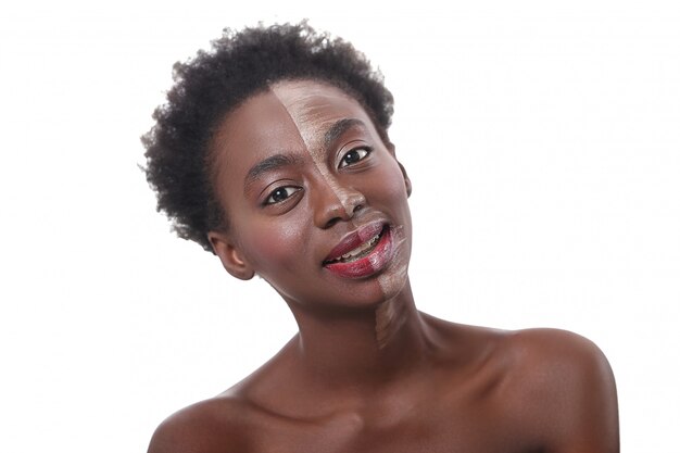 Black woman with half face on makeup, beauty concept