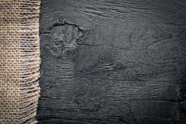 黒い​木製​の​背景​と​古い​布​。​上面図​。​フリー​スペース​。
