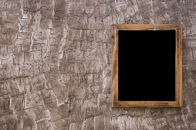 Black wooden slate on wall