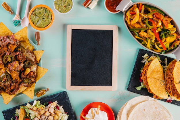 Blackboard amidst Mexican food composition