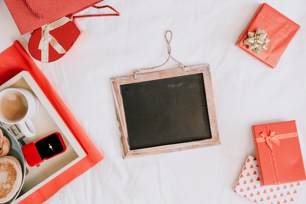 Blackboard amidst presents and breakfast