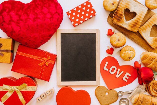 Blackboard amidst presents and pastry