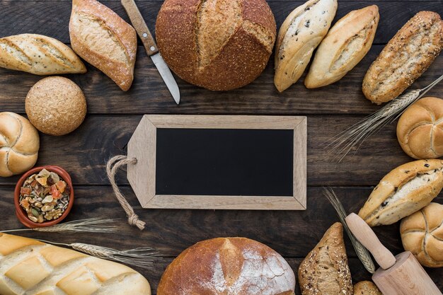 Blackboard and bakery on table