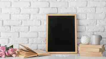 Free photo blackboard and books arrangement