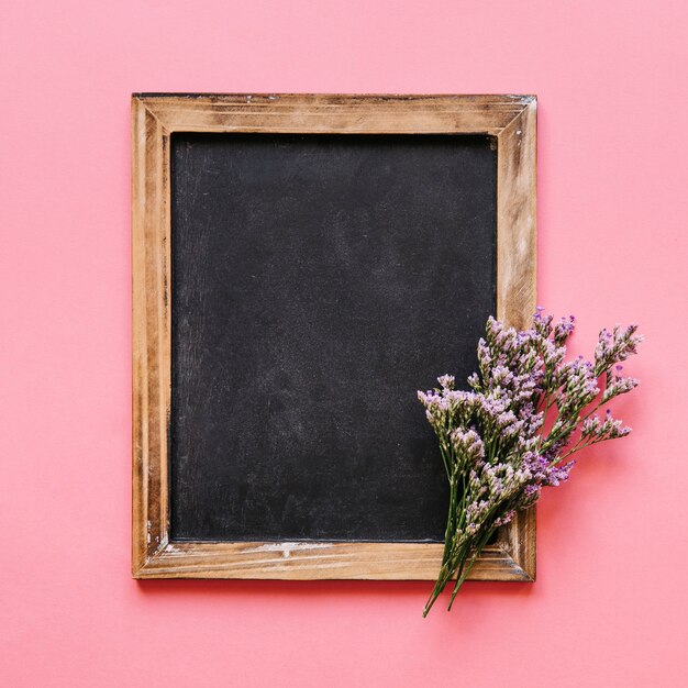 Blackboard and colorful flower