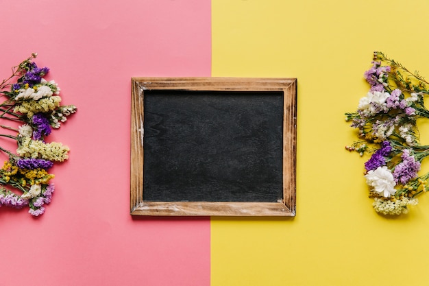 Blackboard and flowers arrangement