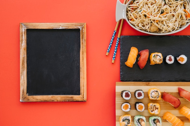 Blackboard near Japanese food on red