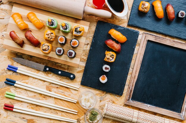 Blackboard near served sushi set