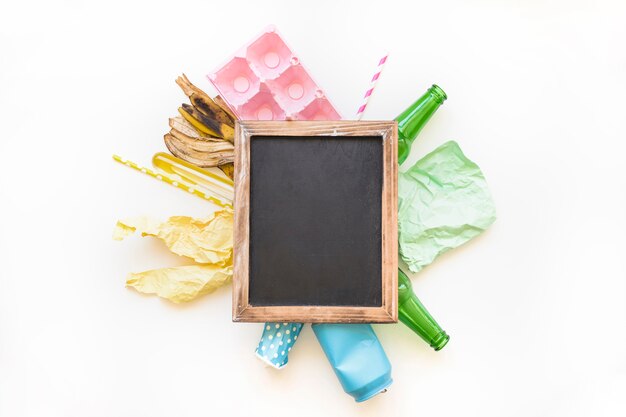 Blackboard on pile of litter