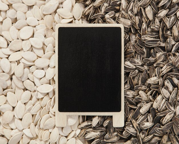 Blackboard on pumpkin and sunflower seeds