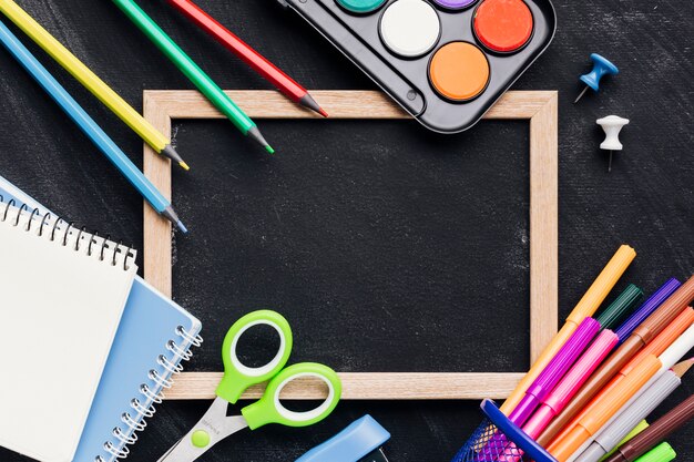 Blackboard slate with bright stationery