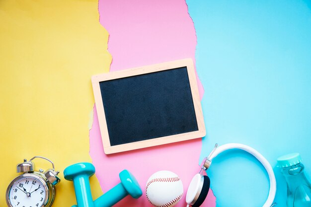 Blackboard over sports equipment